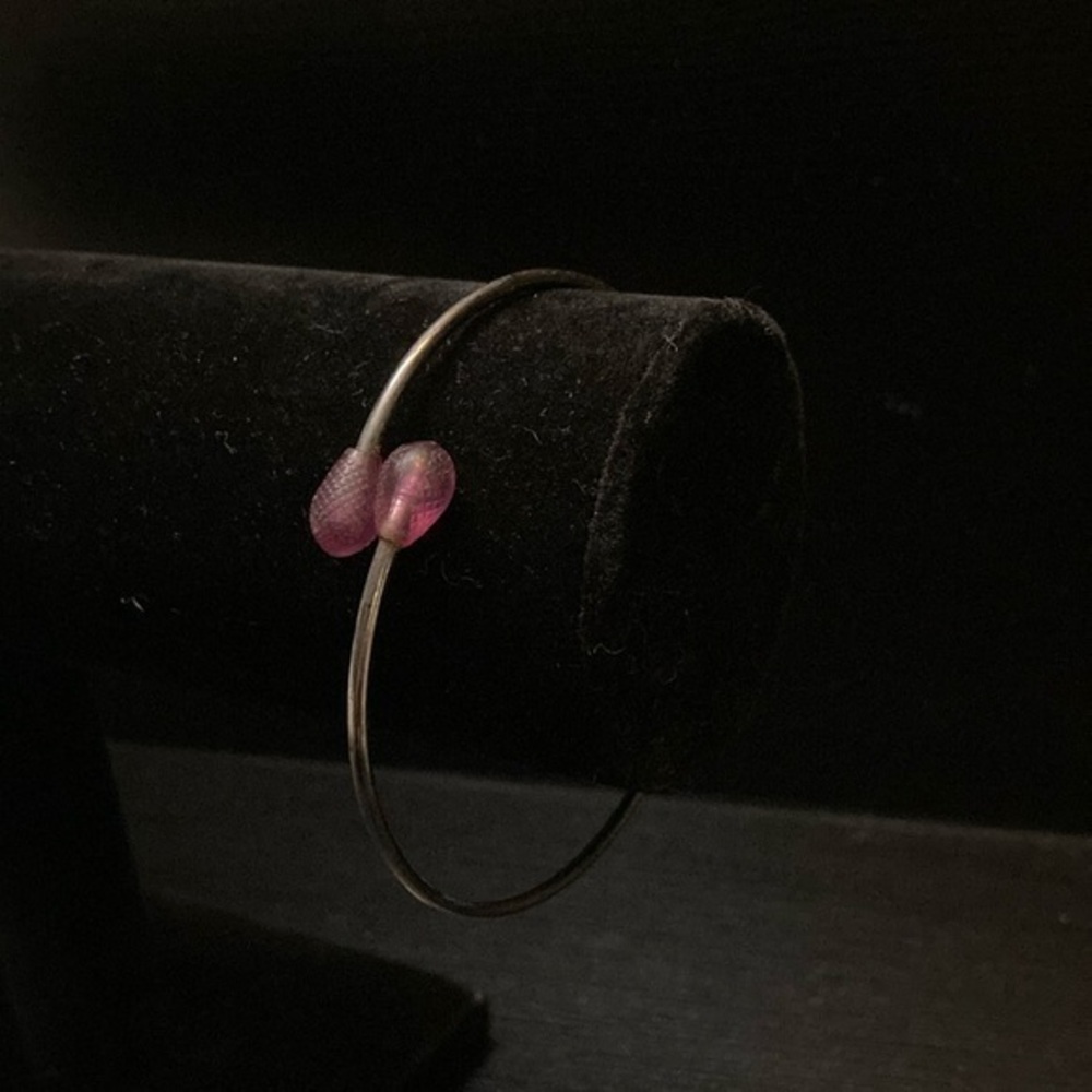 Elegant Silver Bangle with Pink Accents